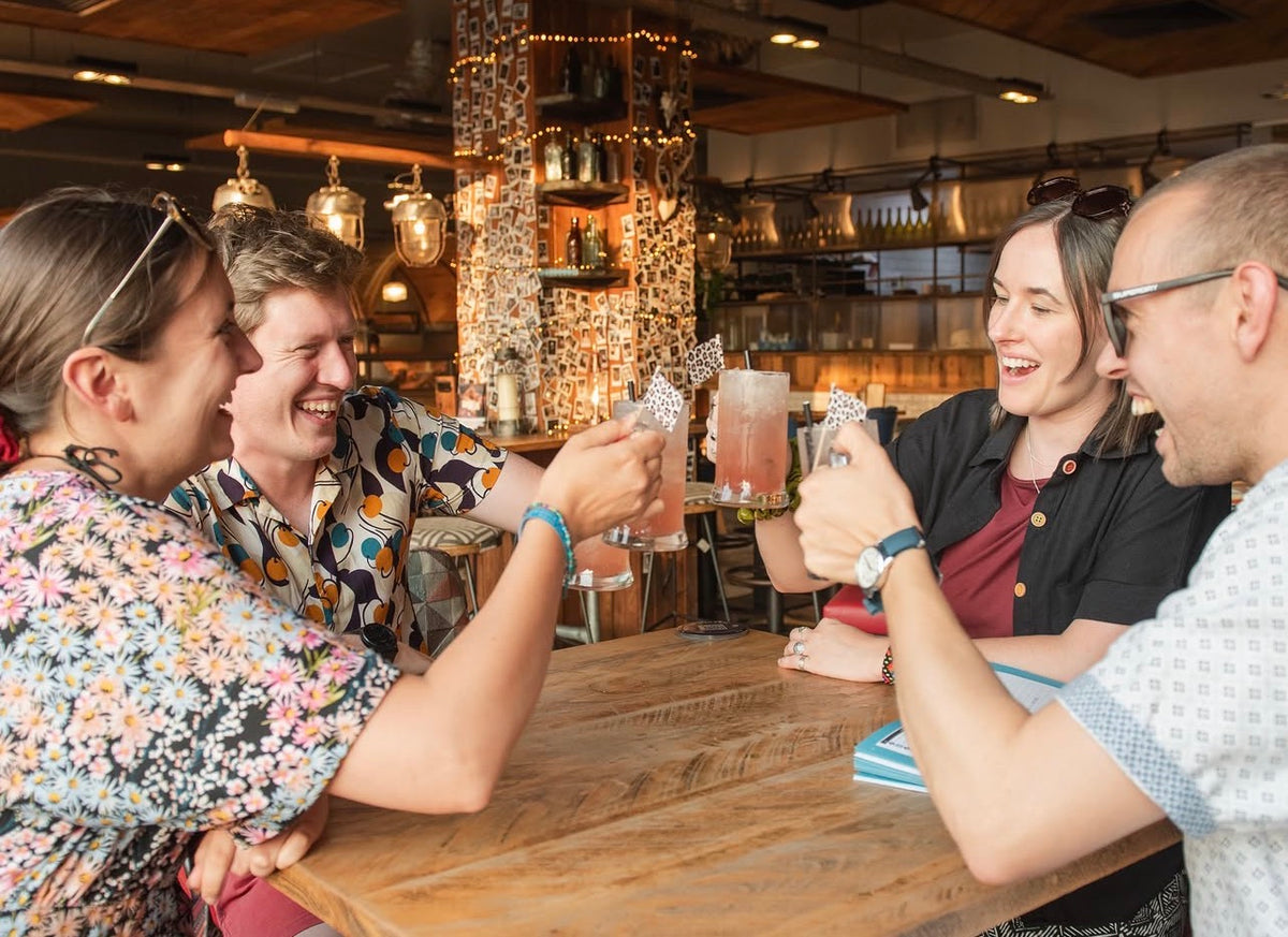 Friends enjoying food and cocktails at Gas Street Social before a trip to the theatre in Birmingham