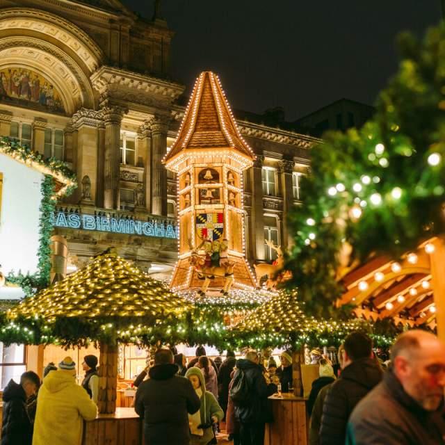 Festive Christmas market stalls and seasonal lights in Birmingham city centre during the Christmas season.