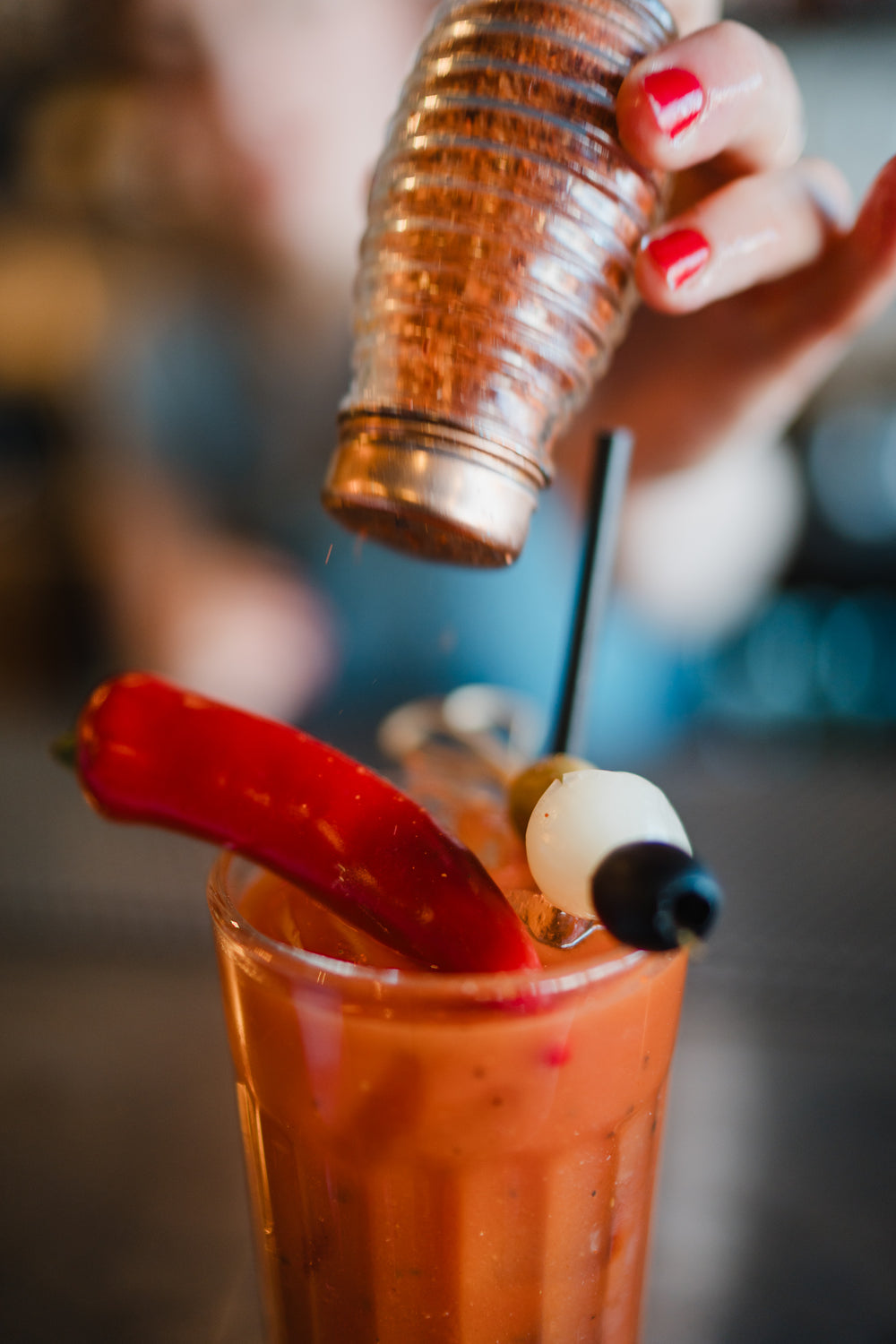 Freshly prepared Bloody Mary cocktail garnished with red pepper and olives at Gas Street Social, a restaurant and cocktail bar in Birmingham.
