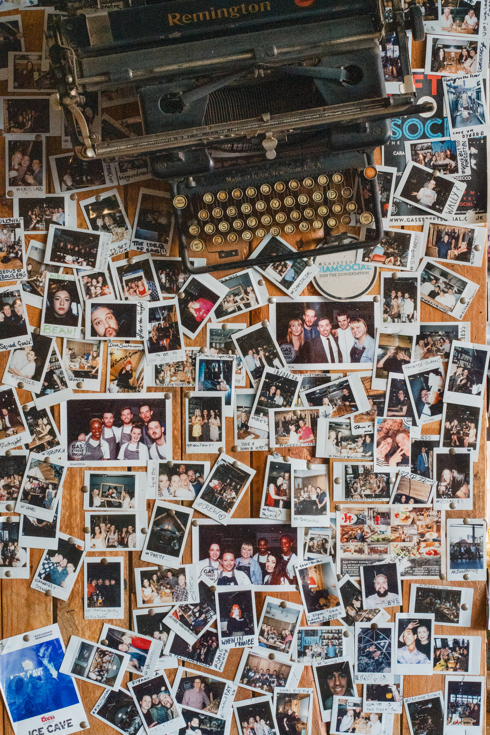 Gas Street Social photowall featuring ten years of customer memories, instant photos and a vintage typewriter inside the Birmingham restaurant.