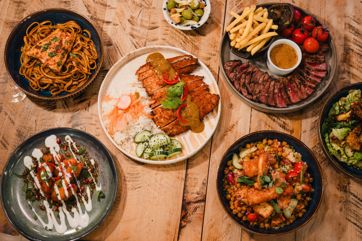 Selection of all-day dishes at Gas Street Social Birmingham, including steak, grilled chicken, salmon pasta and colourful sharing plates.