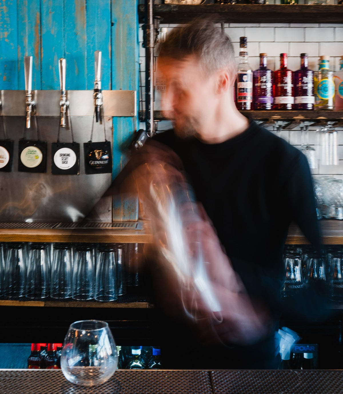 Bartender crafting signature cocktails at Gas Street Social cocktail bar at The Mailbox in Birmingham.