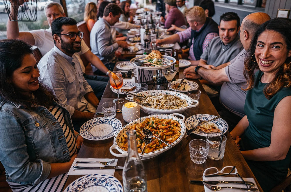 Group celebration enjoying food and drink at Gas Street Social.