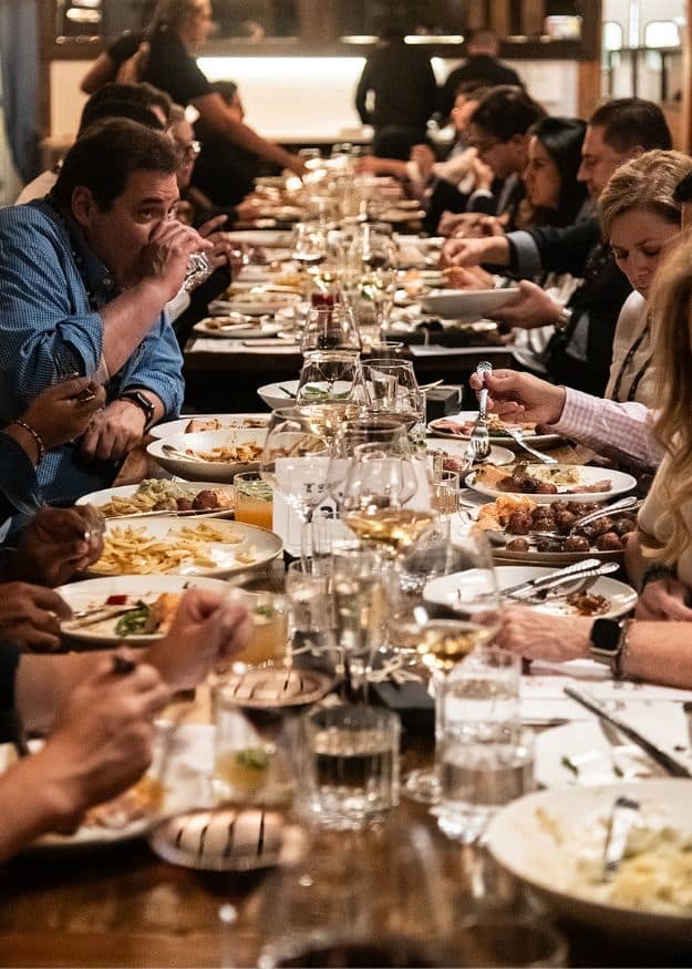 Friends and colleagues celebrating Christmas together over food and drinks at a Birmingham restaurant.