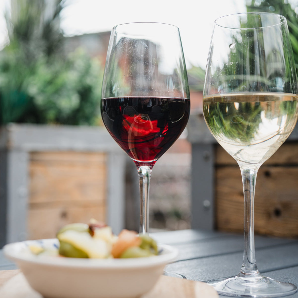Red and white wine with olives at Gas Street Social, The Mailbox, Birmingham, perfect for pre-theatre drinks and dining before a show.